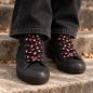 Preview: Skull and guitar printed shoelaces on black high-top shoes