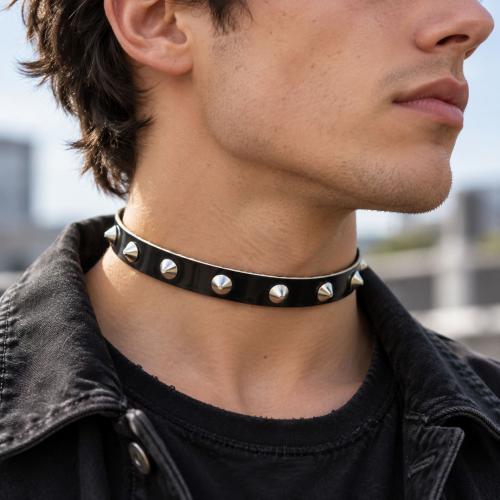 Black patent leather choker with silver-tone conical studs