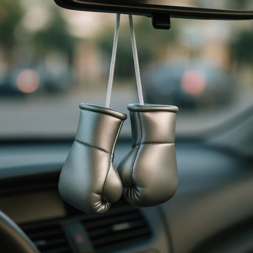 Silver mini boxing gloves hanging from rearview mirror for modern car decor