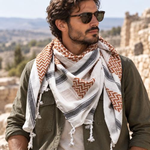 White brown black shemagh scarf worn around the neck in classic keffiyeh style