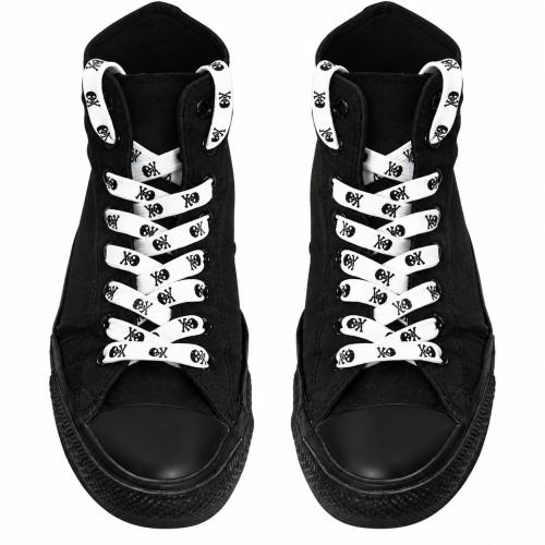 White skull print shoelaces on black high-top sneakers