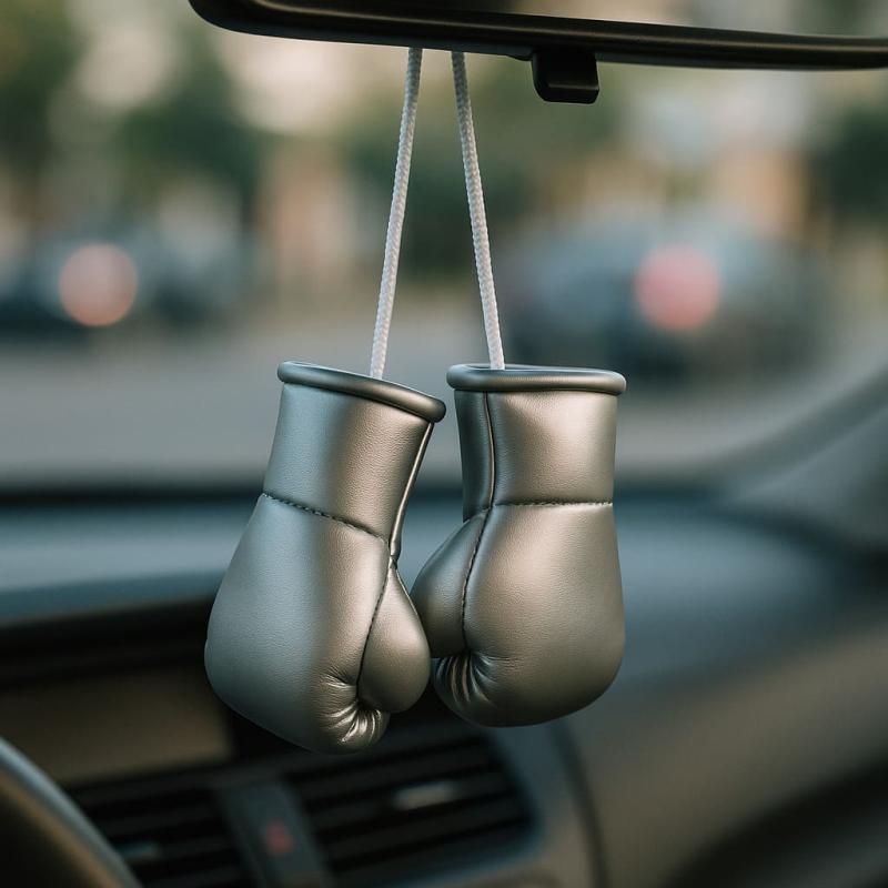 Silver mini boxing gloves hanging from rearview mirror for modern car decor