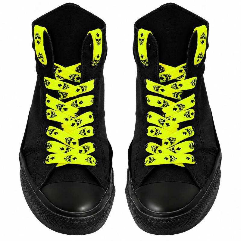 Neon yellow skull print shoelaces on black high-top sneakers